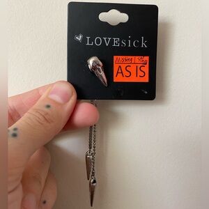 Lovesick bird skull earring